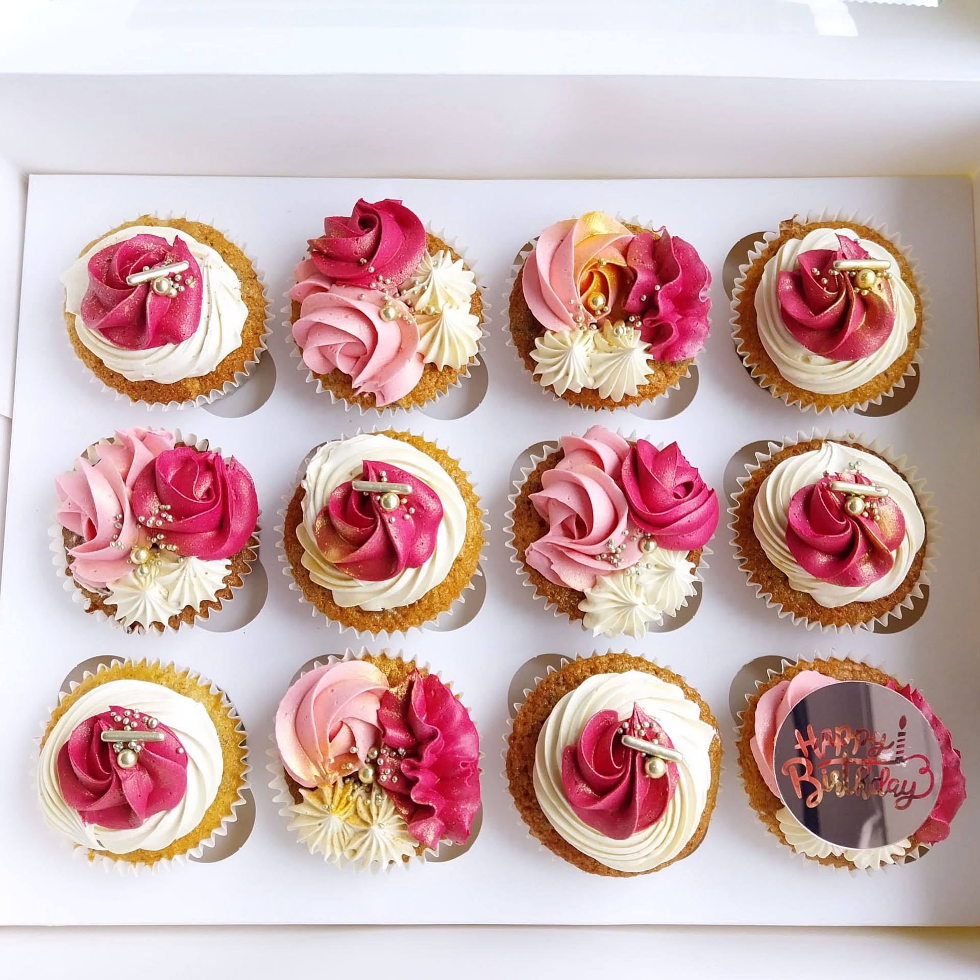 Pink rose cupcakes with gold sprinkle accents