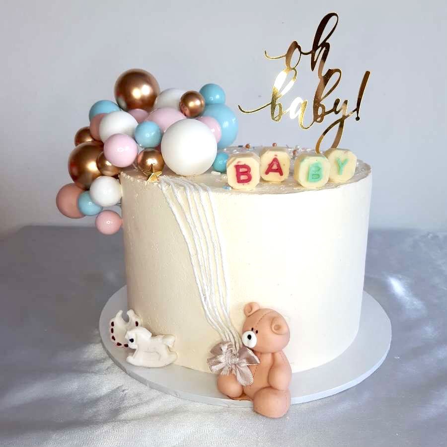 Oh Baby baby shower cake with balloons and teddy bear