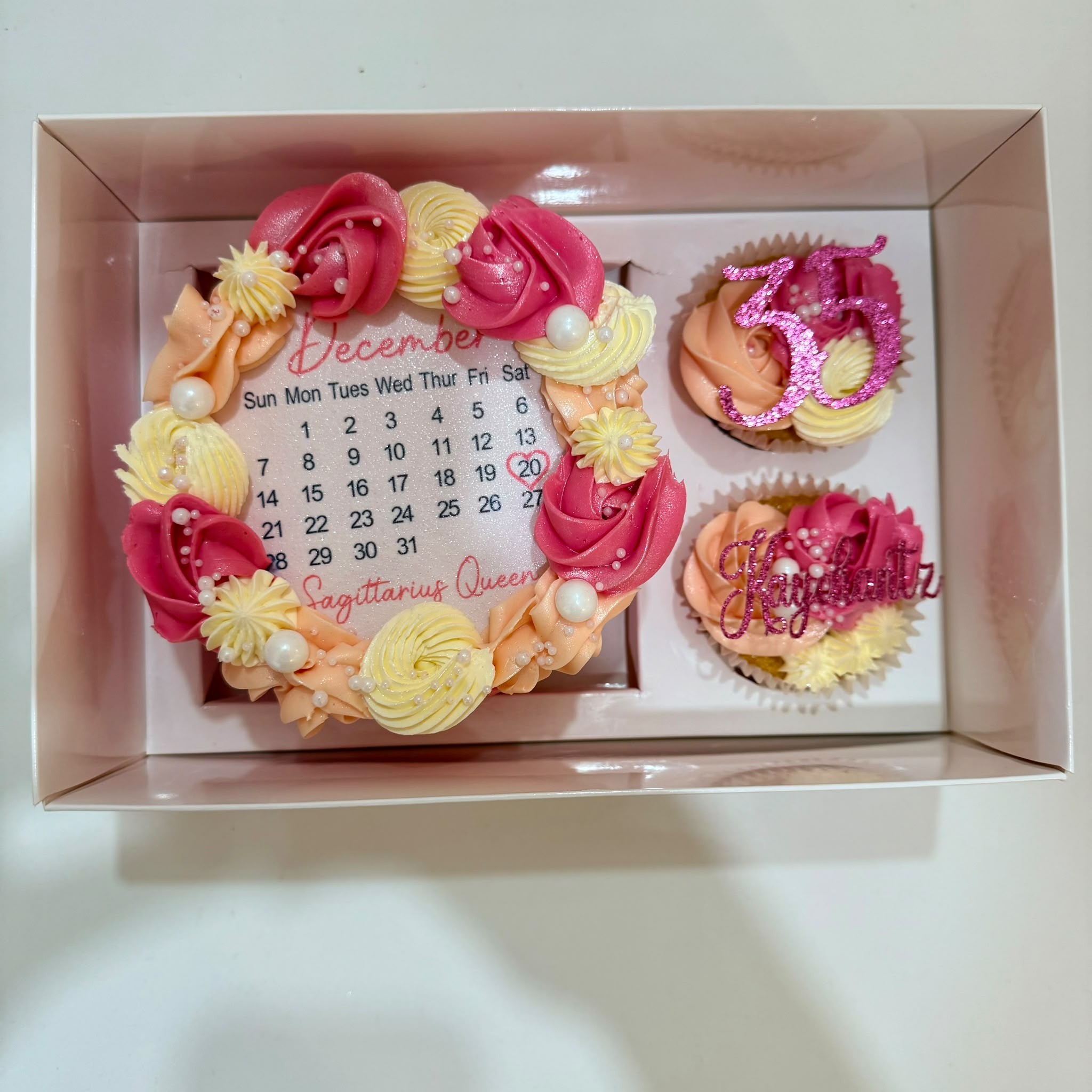 December Sagittarius Queen calendar cake with matching cupcakes