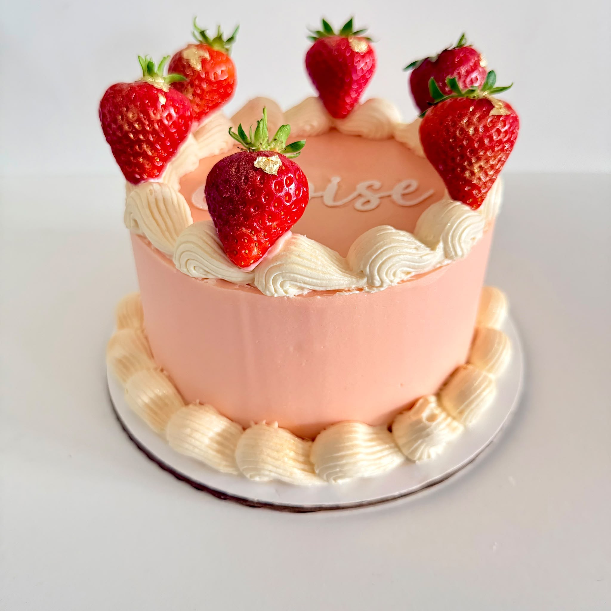 Pink strawberries and cream celebration cake