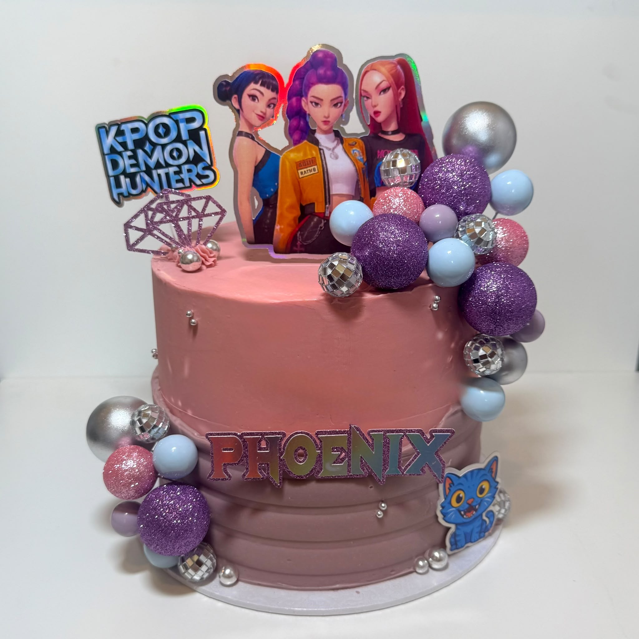 KPOP Demon Hunters Phoenix two-tier pink celebration cake