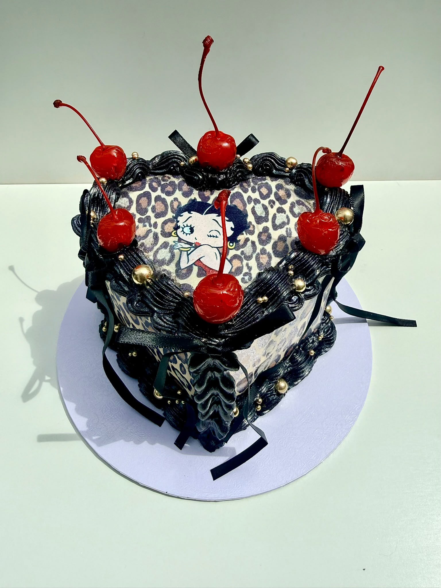 Betty Boop leopard print heart cake with cherries